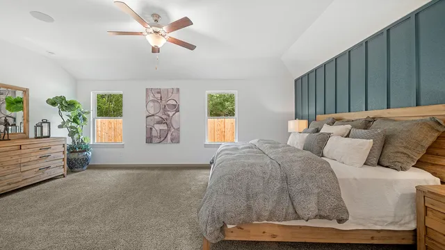 a bed room with a bed and a window