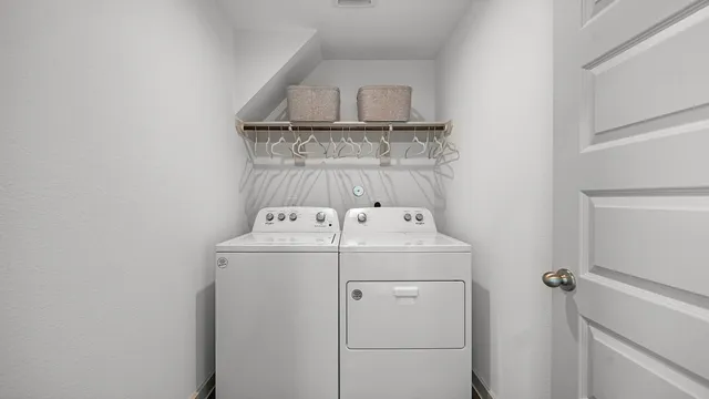 a utility room with dryer and washer