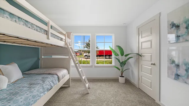 a bedroom with bed and a window