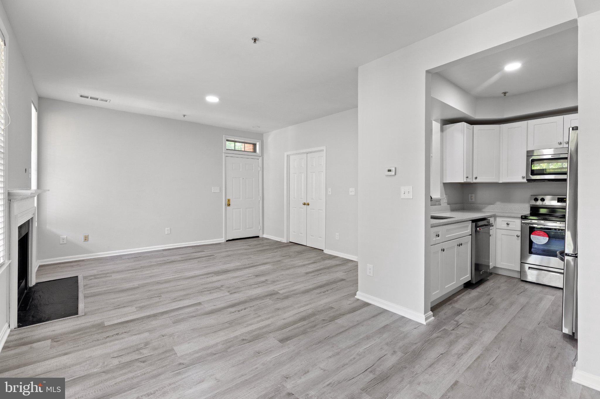 1318 Garden Wall Circle, Unit 213 Reston, VA 20194 - Photo 3 of 22 Bright and airy open living space.