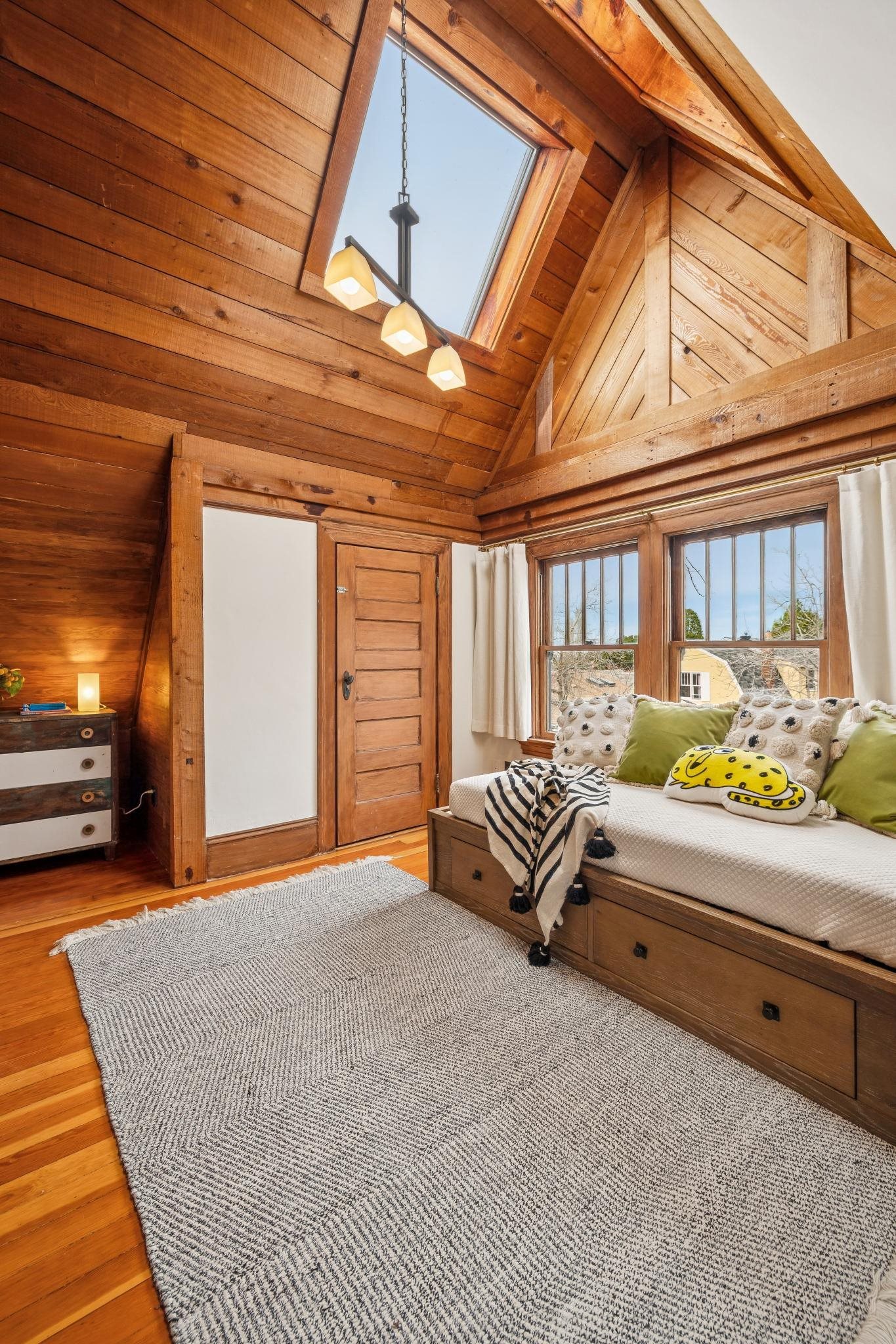 2012 Rose Street Berkeley, CA 94709 - Photo 34 of 57 Bedroom featuring a skylight, a high wood ceiling, wooden walls, and wood finished floors