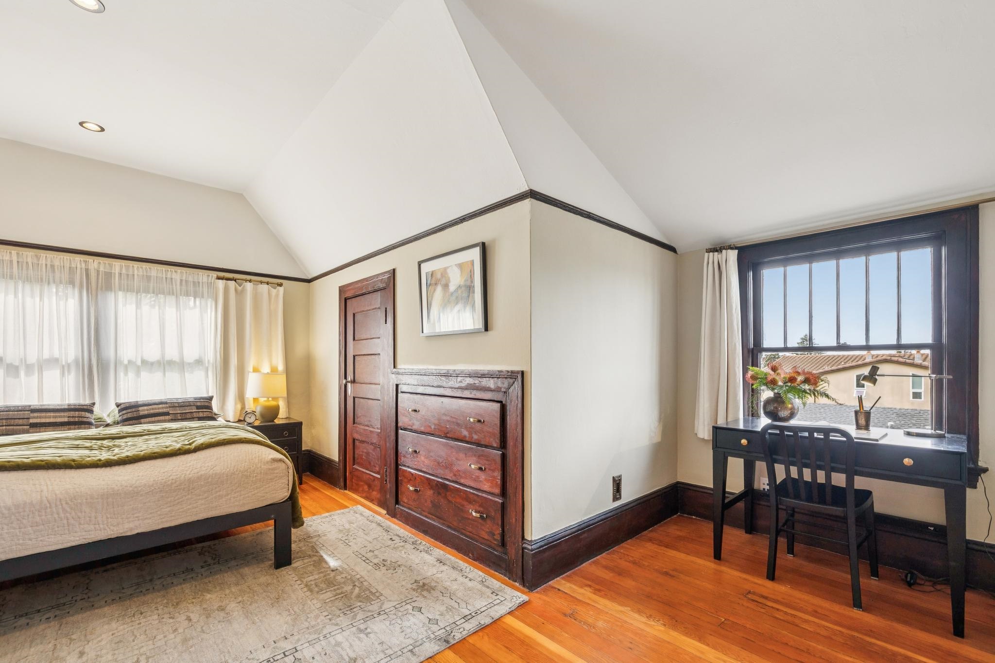 2012 Rose Street Berkeley, CA 94709 - Photo 36 of 57 Bedroom with lofted ceiling, light wood finished floors, and multiple windows