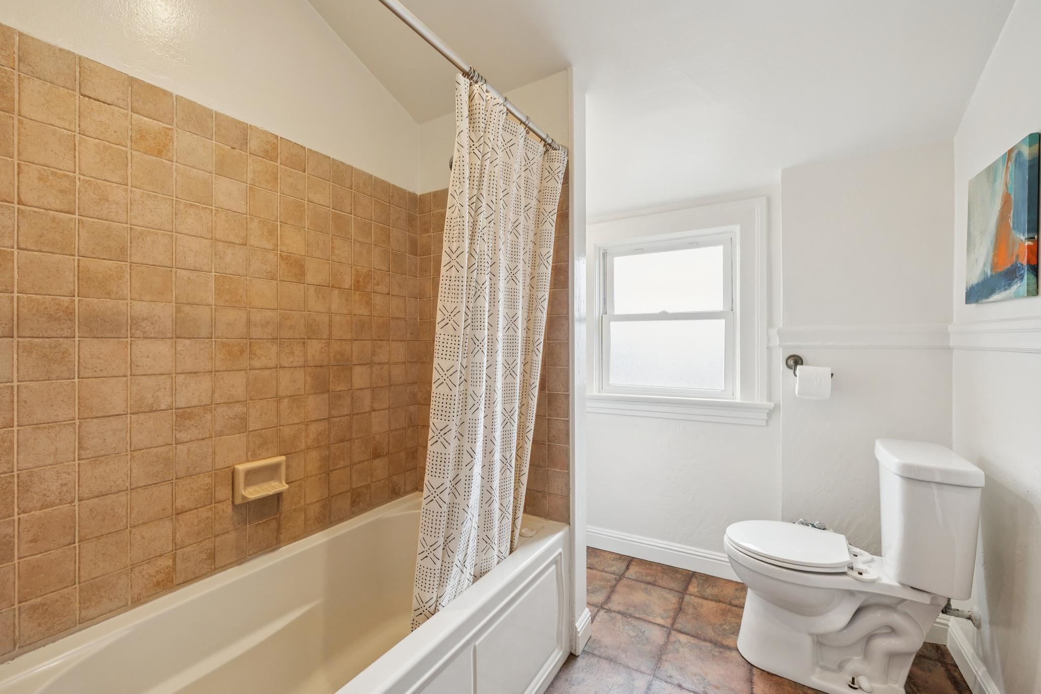 2012 Rose Street Berkeley, CA 94709 - Photo 43 of 57 Full bathroom with shower / tub combo with curtain and stone finish flooring