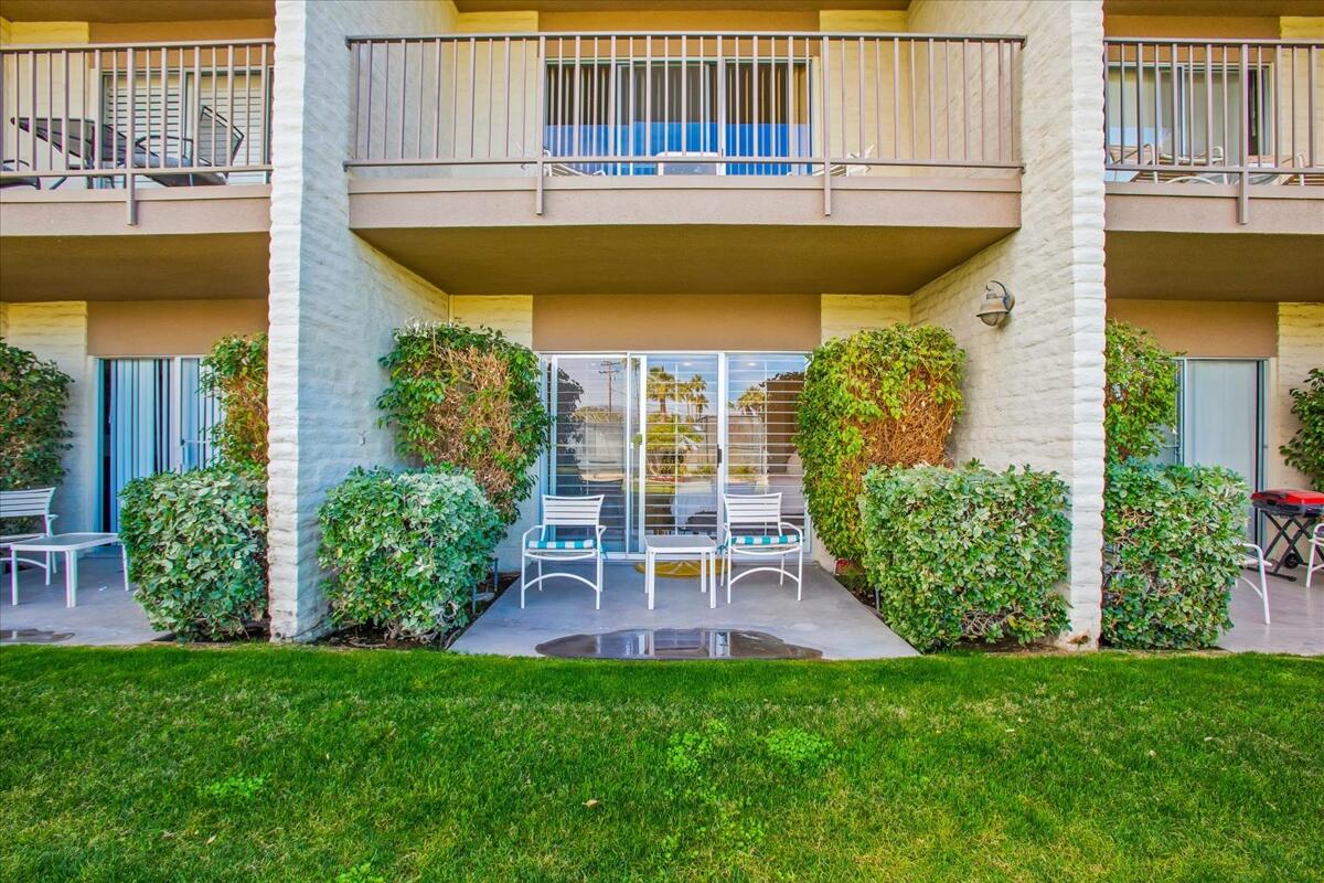 73850 Fairway Drive, Unit 18 Palm Desert, CA 92260 - Photo 19 of 42 a view of a patio with table and chairs and potted plants