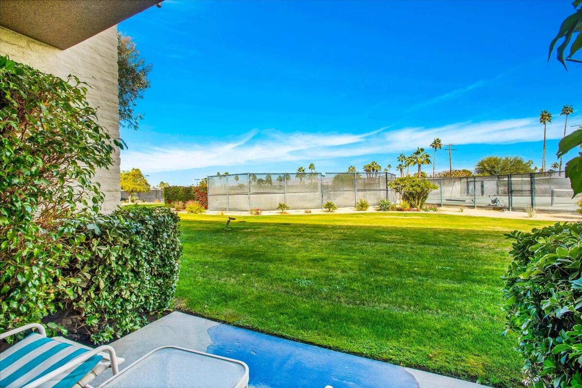 73850 Fairway Drive, Unit 18 Palm Desert, CA 92260 - Photo 22 of 42 a view of yard with swimming pool and outdoor seating