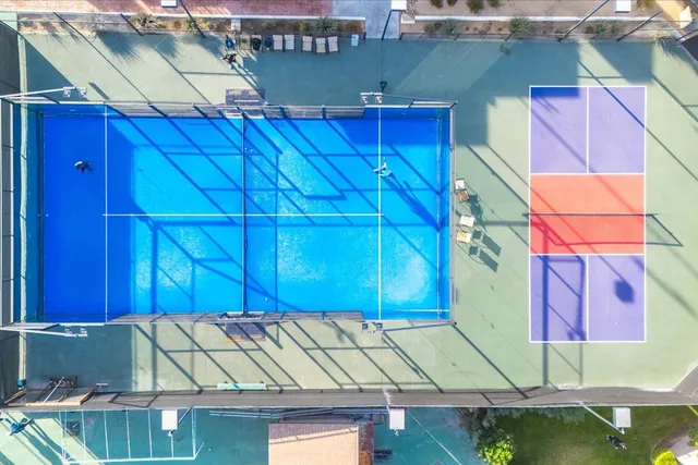 an aerial view of residential houses and outdoor space