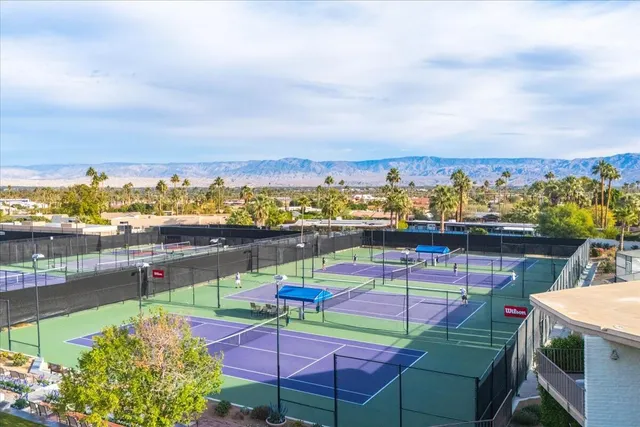 a view of multiple houses with yard