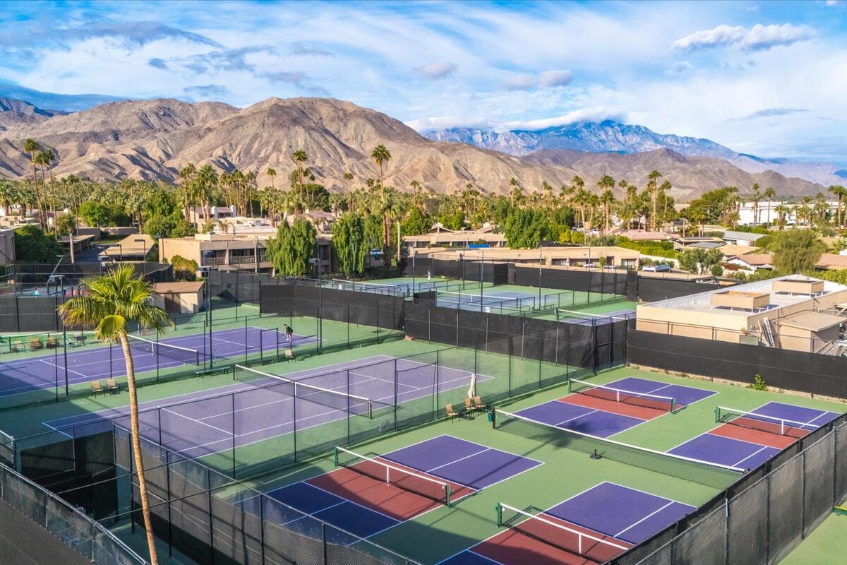 73850 Fairway Drive, Unit 18 Palm Desert, CA 92260 - Photo 38 of 42 a view of a city that has lawn chairs