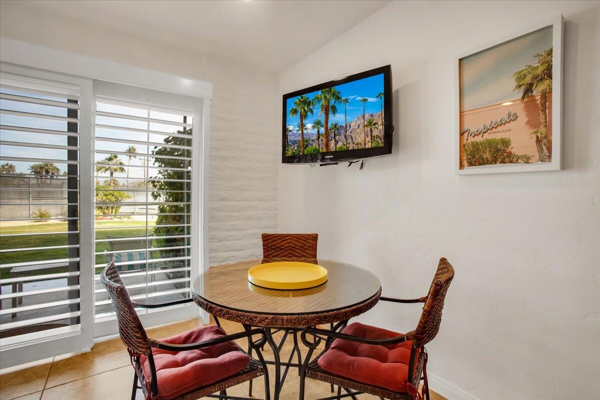 73850 Fairway Drive, Unit 18 Palm Desert, CA 92260 - Photo 10 of 42 a view of a dining room with furniture and a window