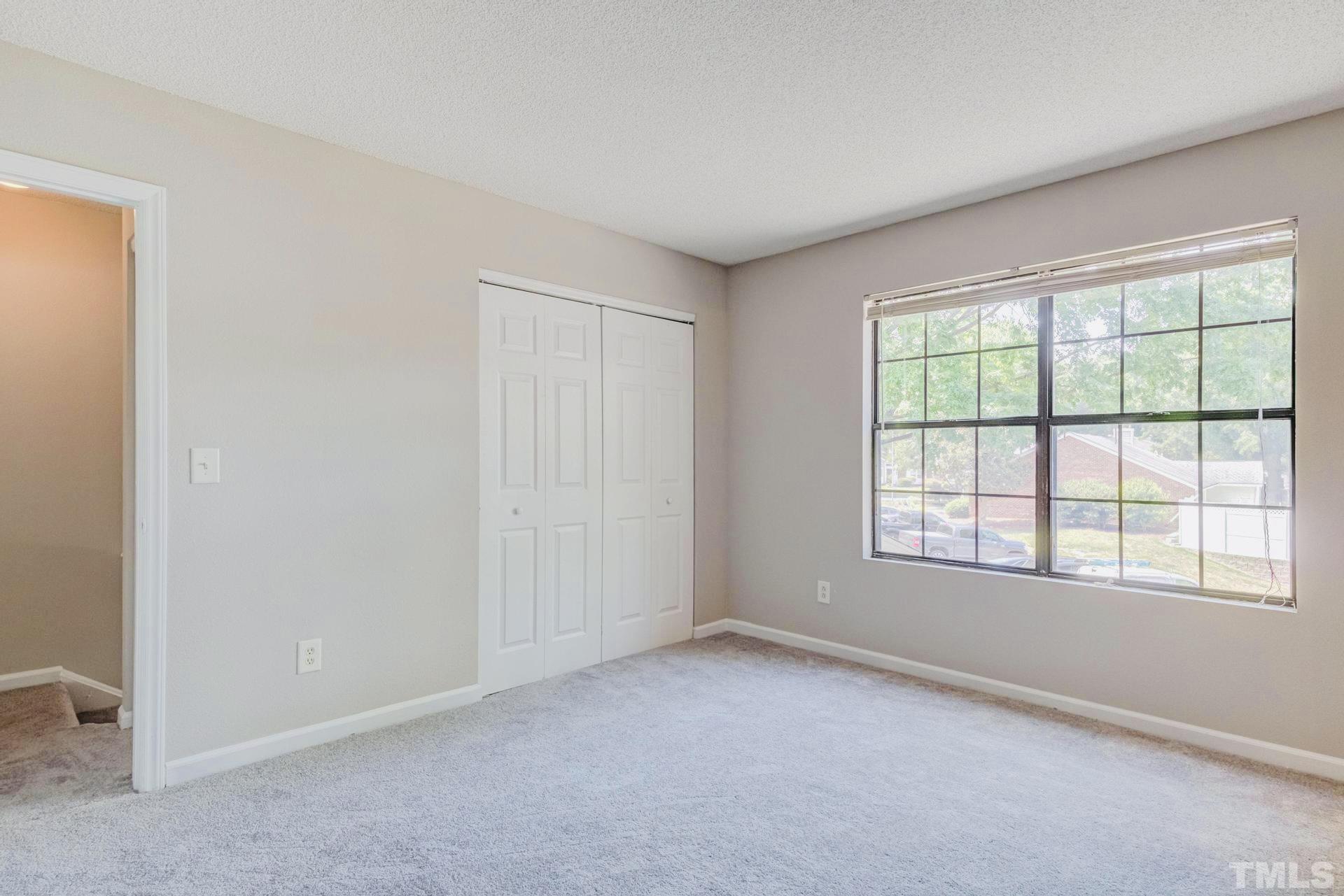 7913 Falcon Rest Circle Raleigh, NC 27615 - Photo 12 of 22 an empty room with a window