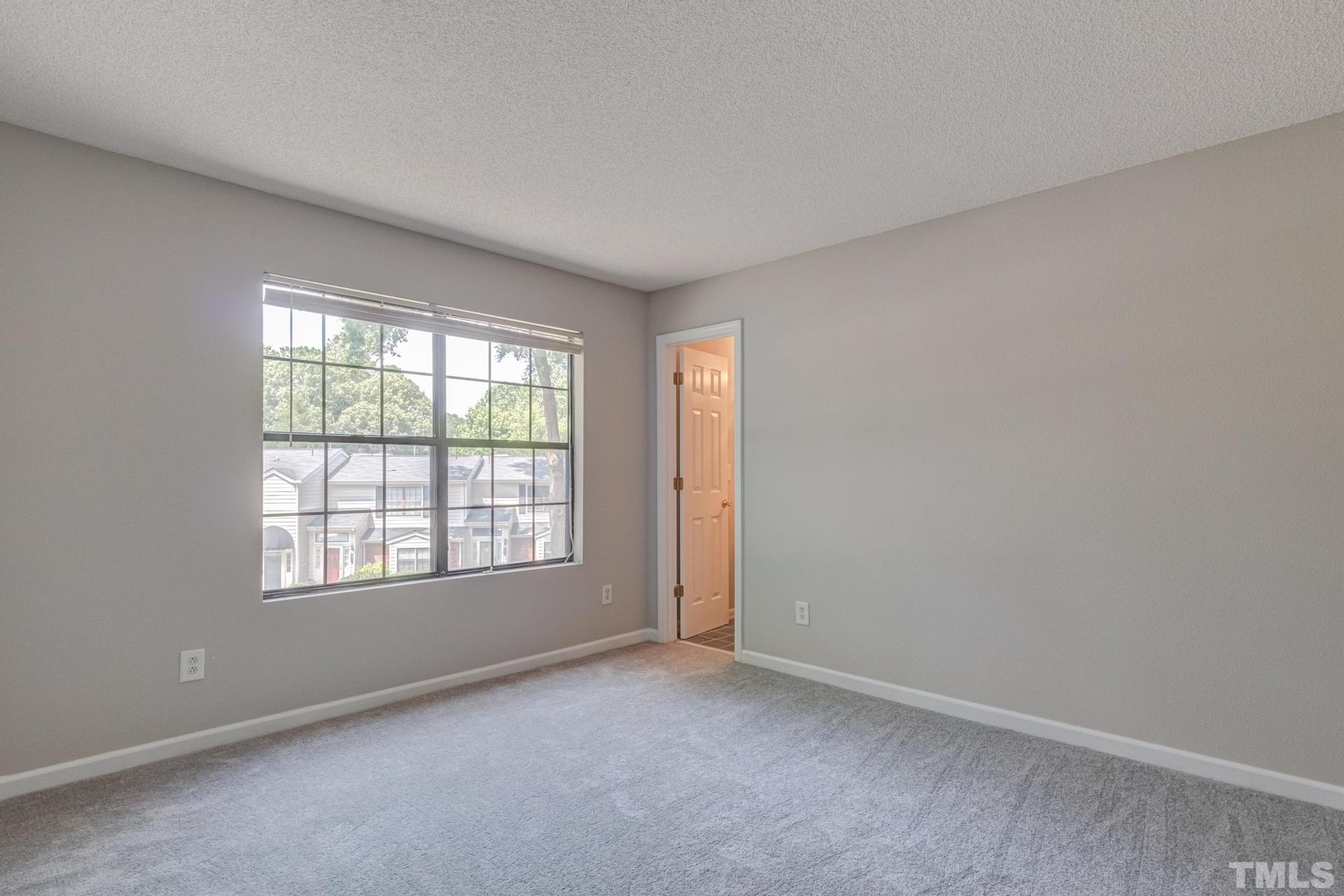 7913 Falcon Rest Circle Raleigh, NC 27615 - Photo 13 of 22 an empty room with a window