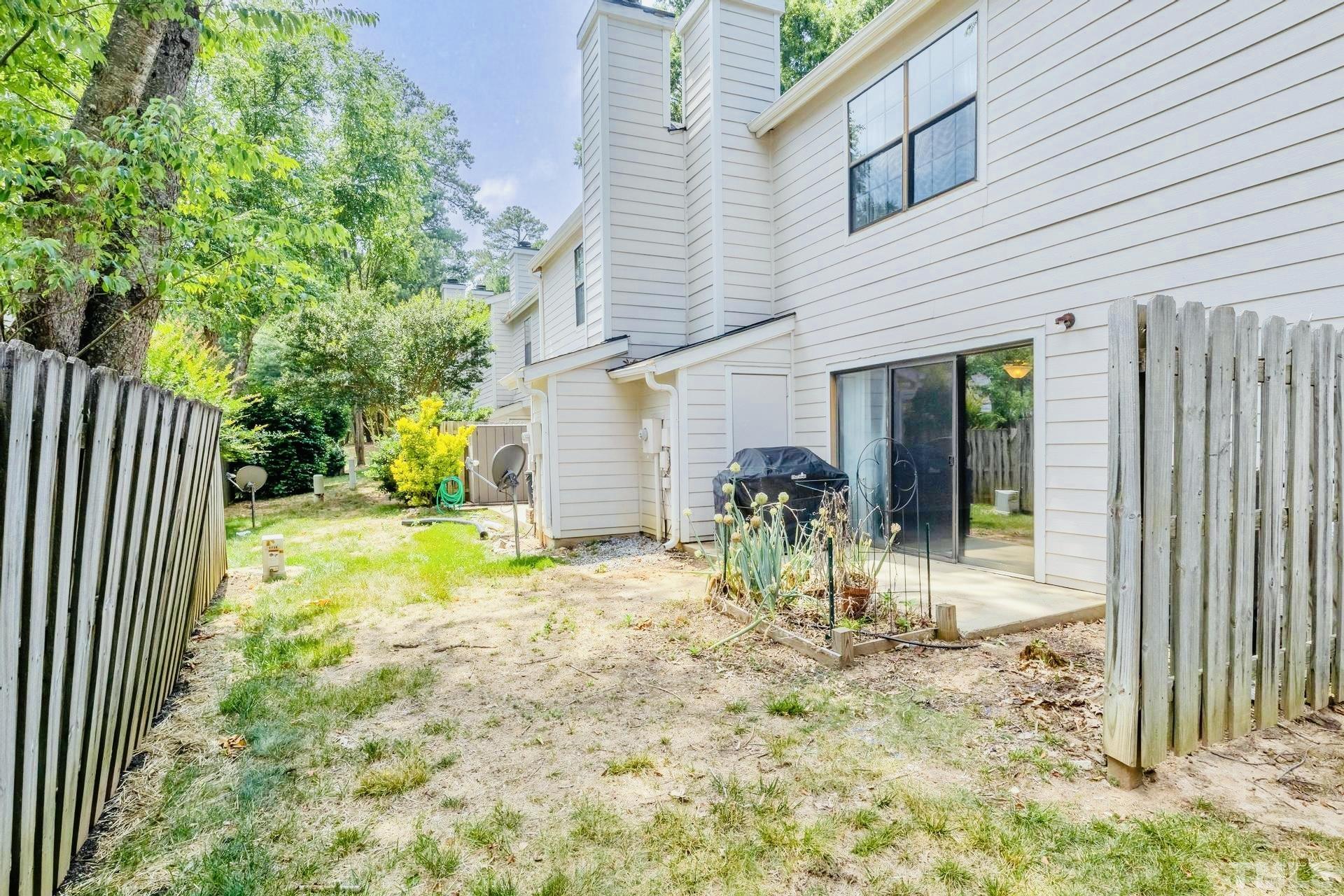 7913 Falcon Rest Circle Raleigh, NC 27615 - Photo 20 of 22 a view of a house with backyard and sitting area