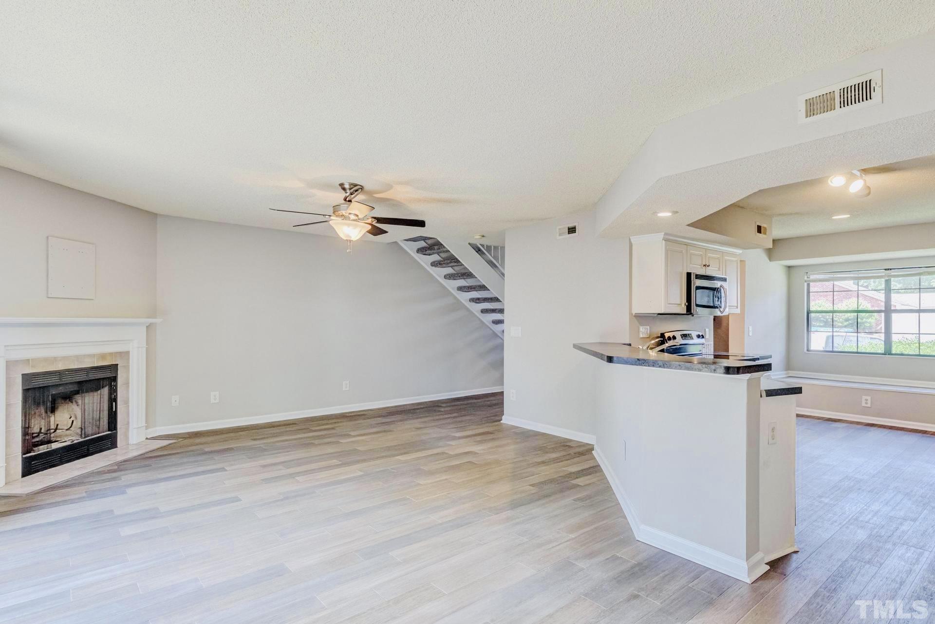 7913 Falcon Rest Circle Raleigh, NC 27615 - Photo 5 of 22 a view of a kitchen and wooden floor