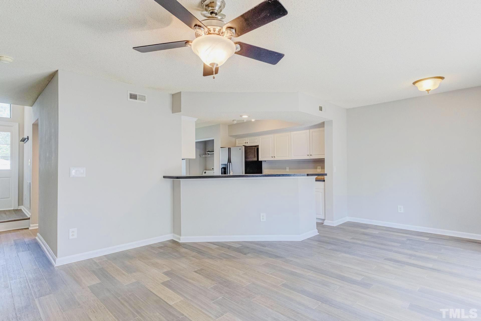 7913 Falcon Rest Circle Raleigh, NC 27615 - Photo 6 of 22 a view of a kitchen with marble kitchen and refrigerator