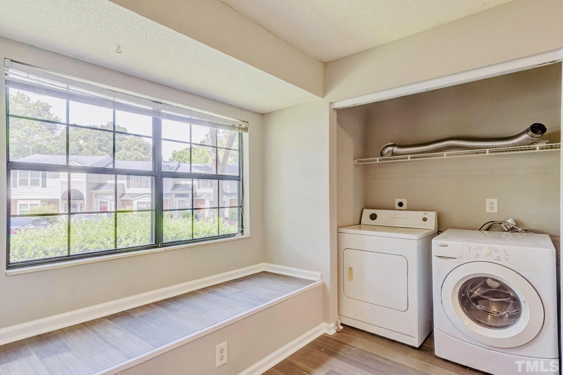 7913 Falcon Rest Circle Raleigh, NC 27615 - Photo 10 of 22 a utility room with dryer and washer