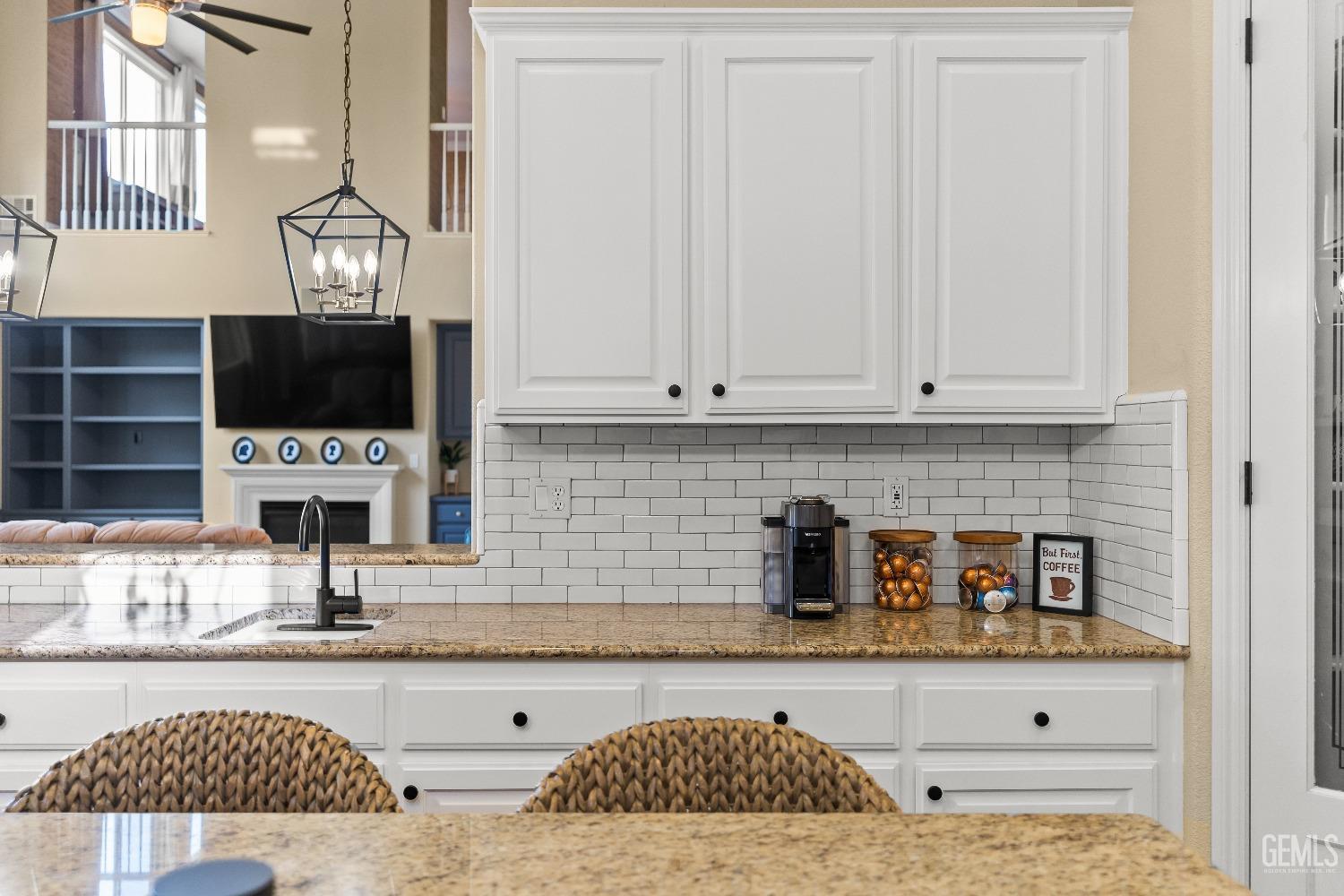 Undisclosed Address Bakersfield, CA 93314 - Photo 15 of 46 a kitchen with a sink and a stove top oven