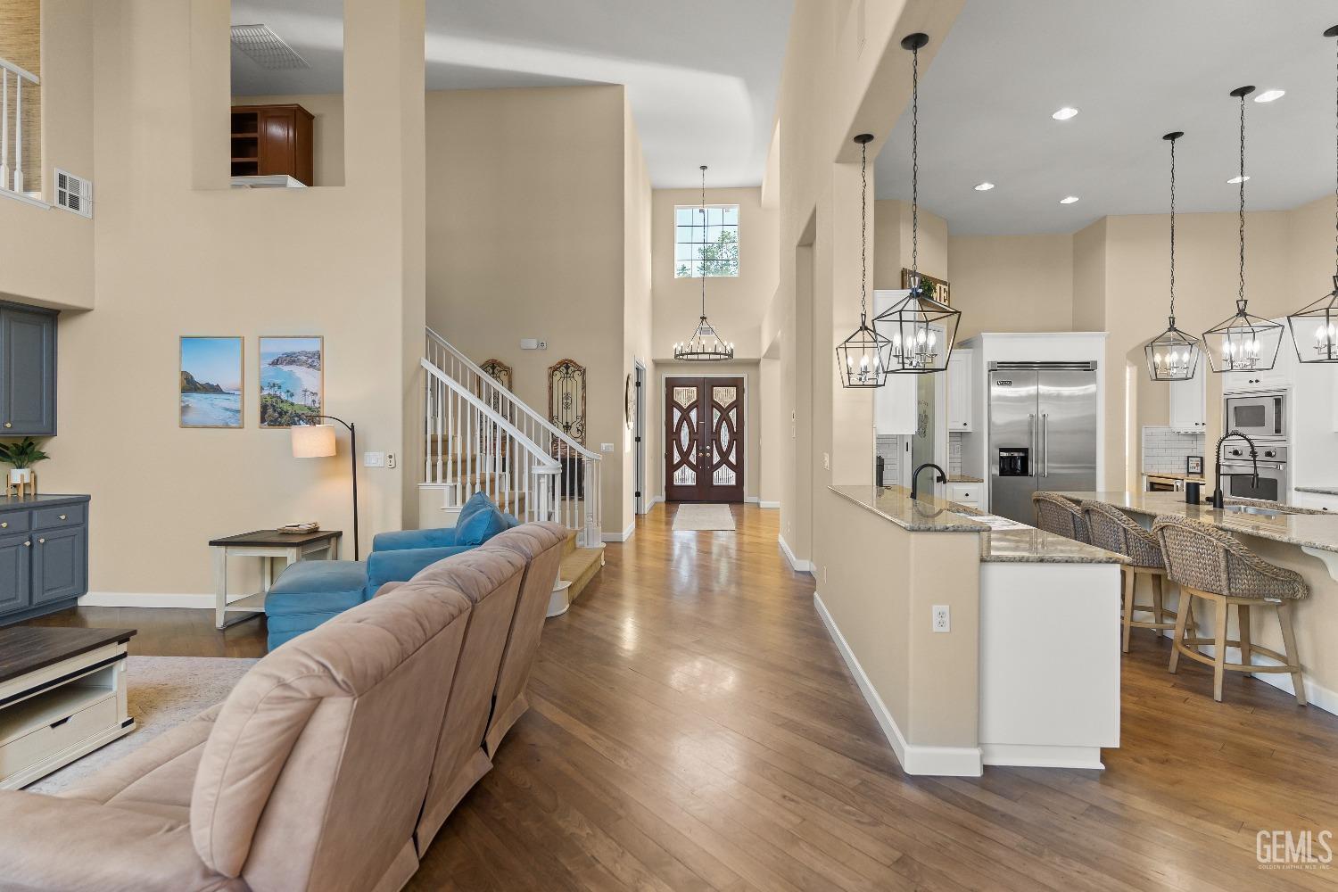 Undisclosed Address Bakersfield, CA 93314 - Photo 17 of 46 a living room with furniture a wooden floor and a large window