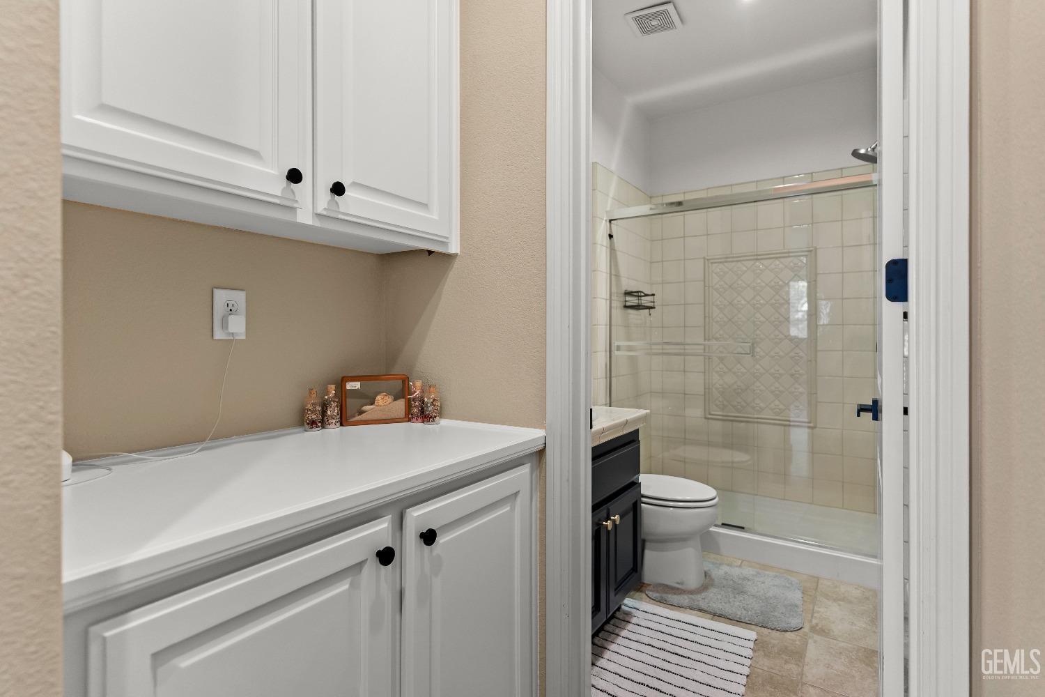 Undisclosed Address Bakersfield, CA 93314 - Photo 18 of 46 a bathroom with a sink a toilet and shower