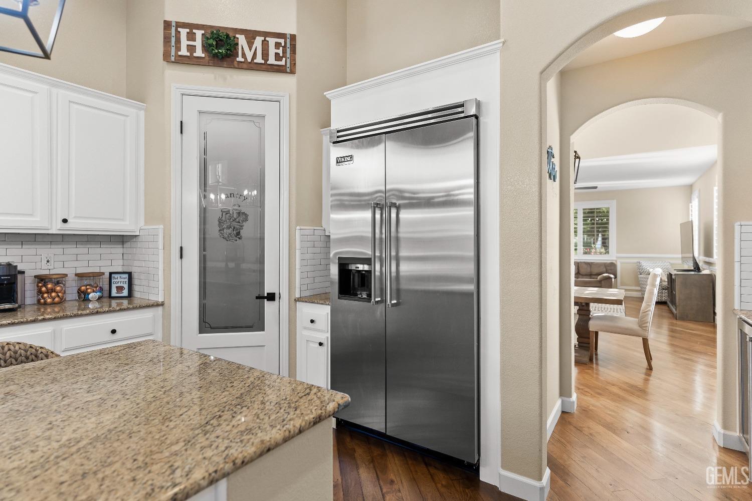 Undisclosed Address Bakersfield, CA 93314 - Photo 20 of 46 a kitchen with stainless steel appliances granite countertop a refrigerator and a sink
