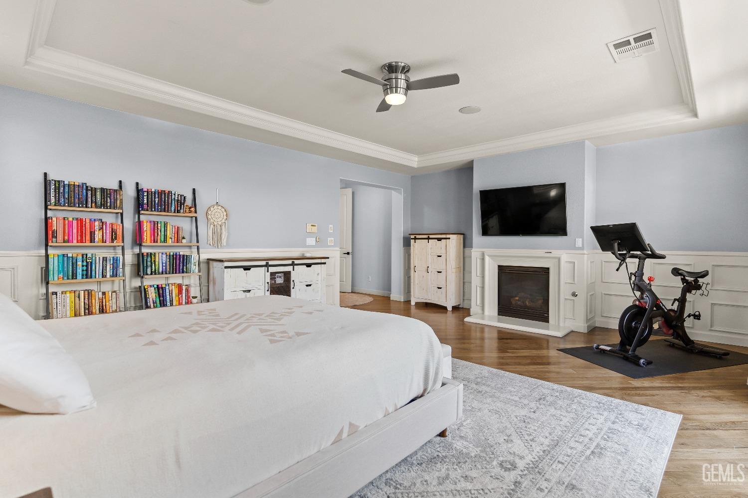 Undisclosed Address Bakersfield, CA 93314 - Photo 24 of 46 a bedroom with a bed a flat screen tv and a fireplace