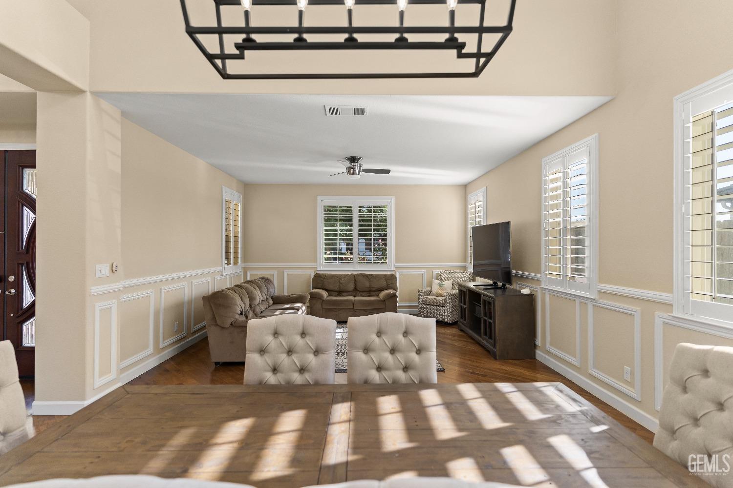 Undisclosed Address Bakersfield, CA 93314 - Photo 25 of 46 a living room with furniture a flat screen tv and a window