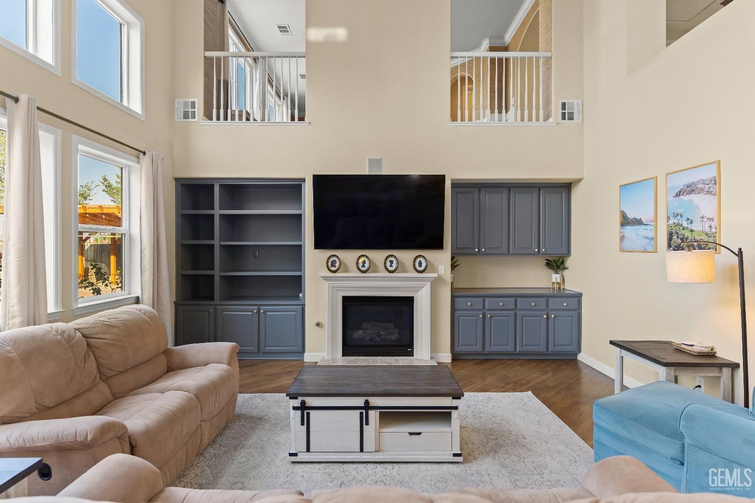 Undisclosed Address Bakersfield, CA 93314 - Photo 28 of 46 a living room with furniture a fireplace and a flat screen tv