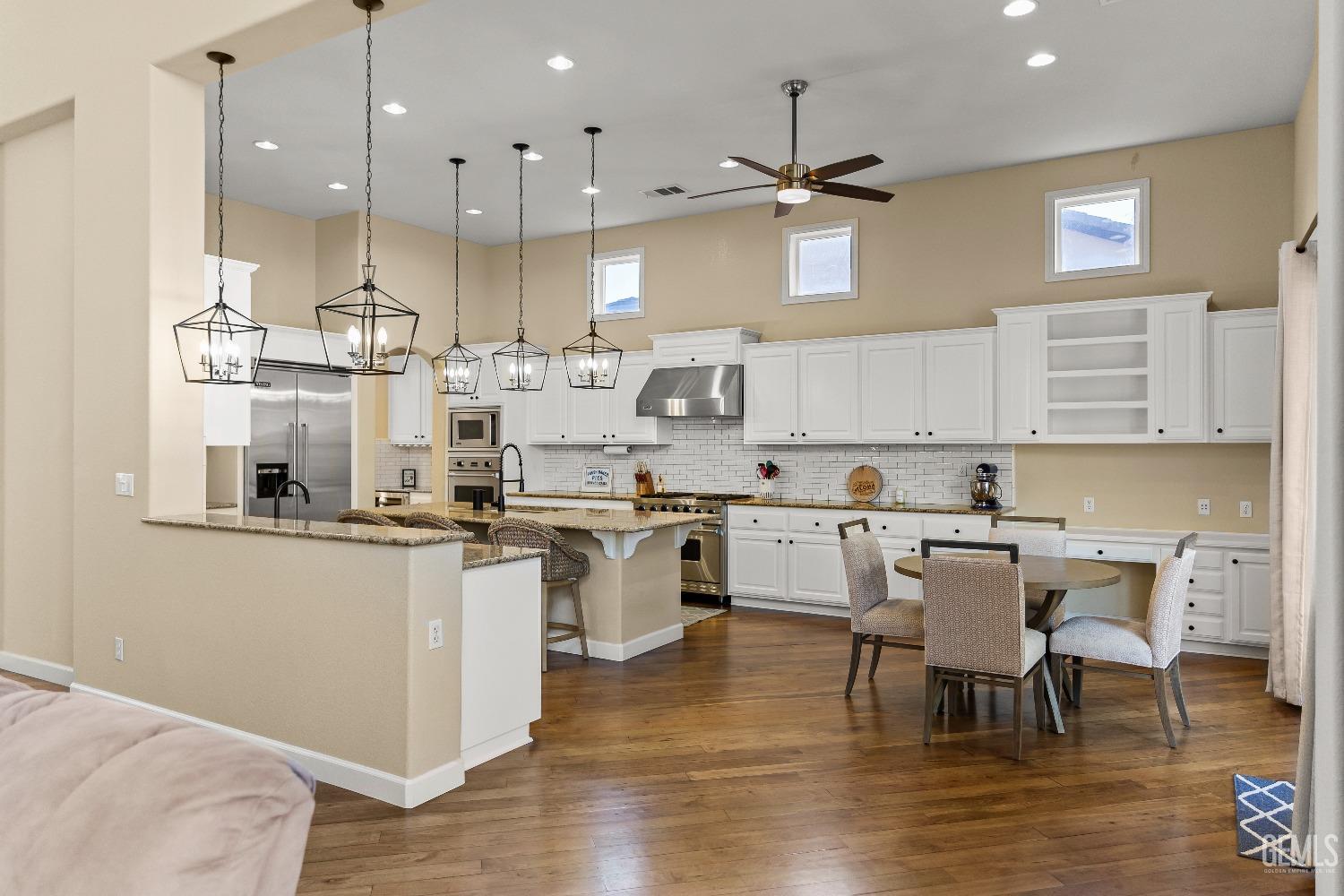 Undisclosed Address Bakersfield, CA 93314 - Photo 34 of 46 a kitchen with a sink cabinets and wooden floor