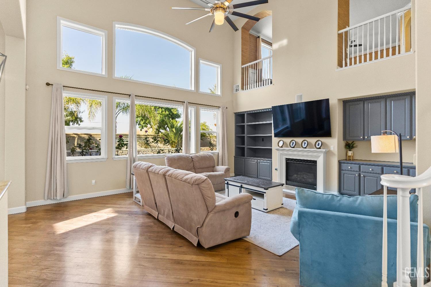Undisclosed Address Bakersfield, CA 93314 - Photo 40 of 46 a living room with furniture a fireplace and a flat screen tv