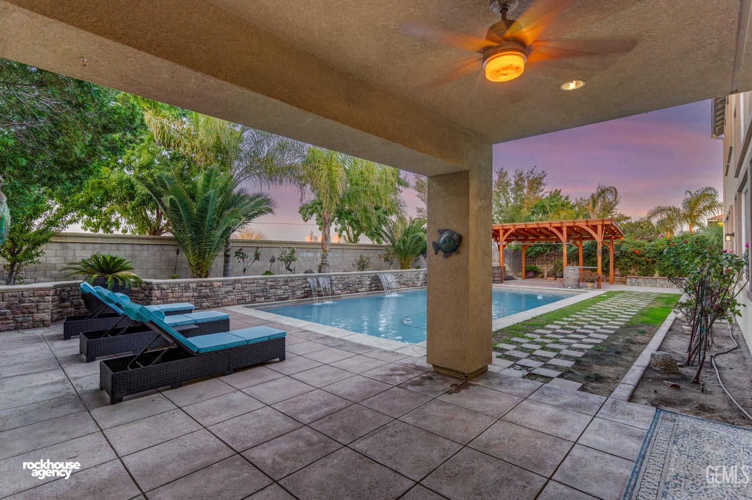 Undisclosed Address Bakersfield, CA 93314 - Photo 4 of 46 a front view of a house with garden