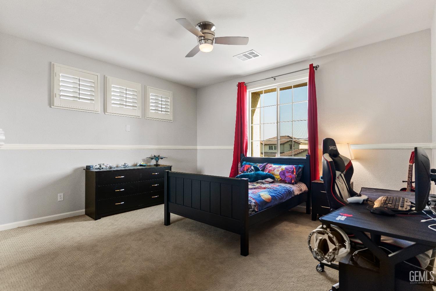 Undisclosed Address Bakersfield, CA 93314 - Photo 41 of 46 a bedroom with a workspace