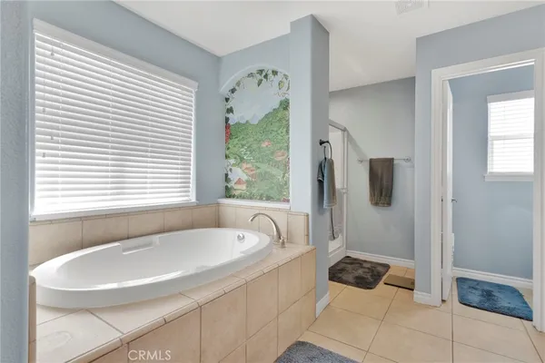 a bathroom with a bathtub and a sink
