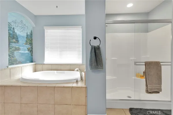 a bathroom with a bathtub and a sink