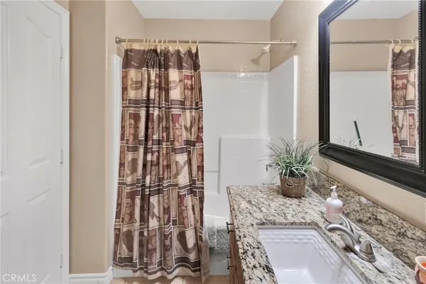 a view of a livingroom with furniture and a window