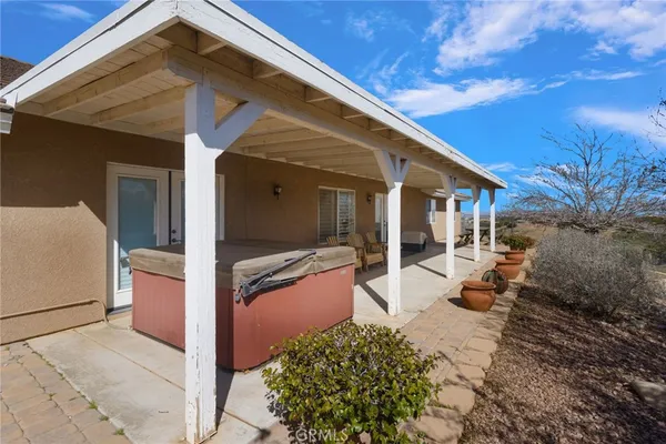 a view of a yard with an outdoor space