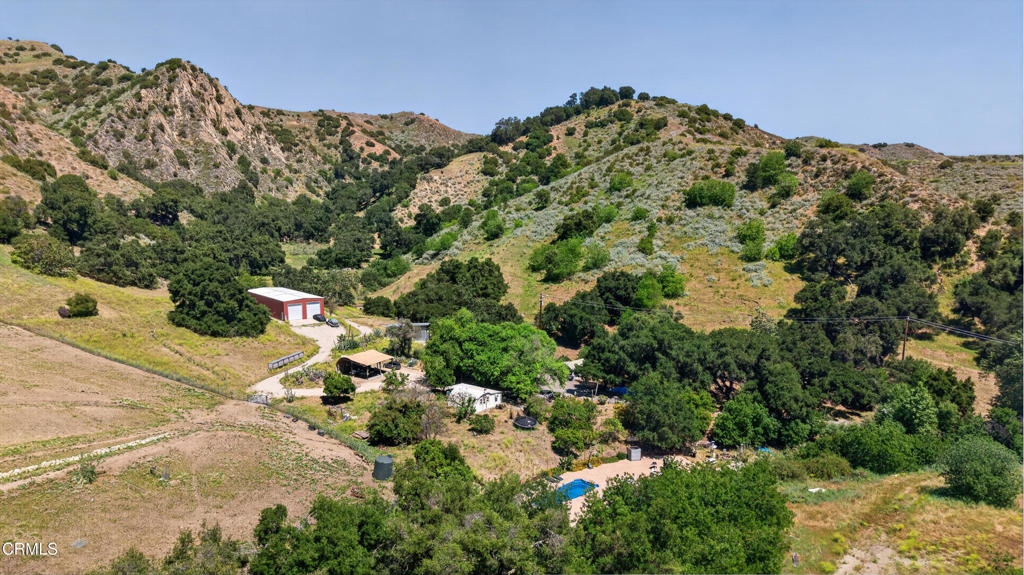 8416 Wheeler Canyon Road Santa Paula, CA 93060 - Photo 2 of 48 a view of a large building with a mountain in the background