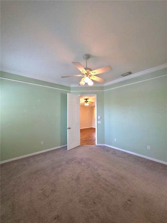 5465 High Pasture Way Melbourne, FL 32940 - Photo 19 of 39 a view of an empty room with a window