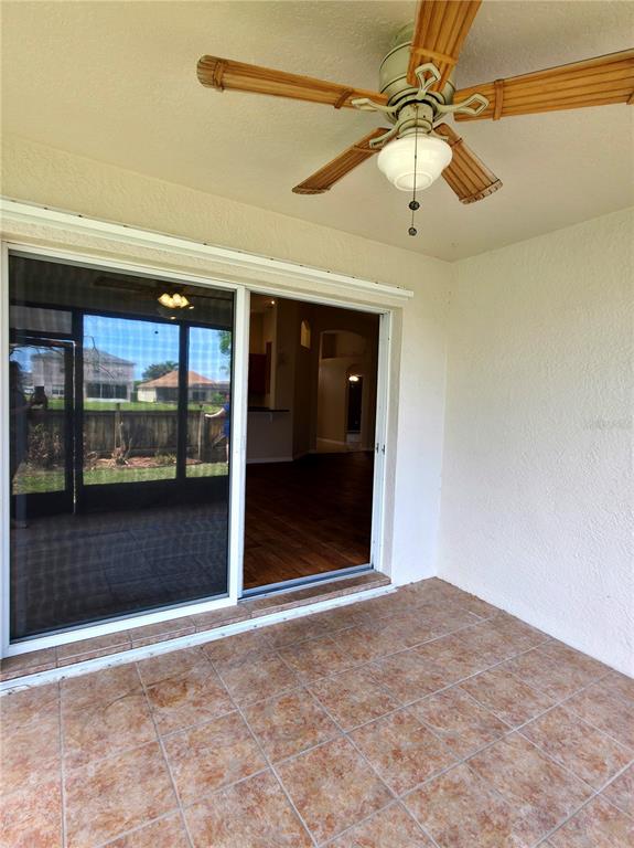 5465 High Pasture Way Melbourne, FL 32940 - Photo 24 of 39 a view of a hallway with a glass door