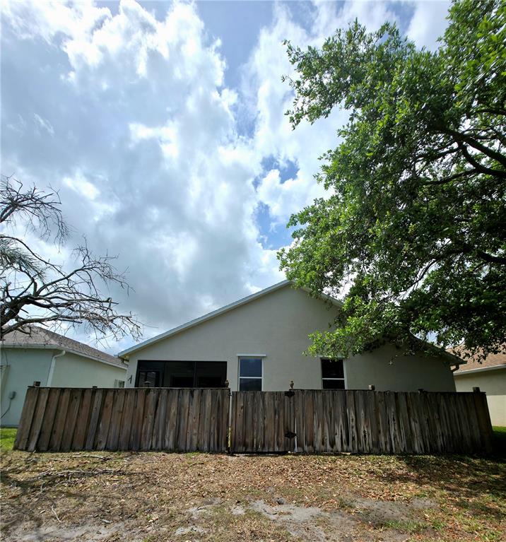 5465 High Pasture Way Melbourne, FL 32940 - Photo 26 of 39 a view of wooden fence