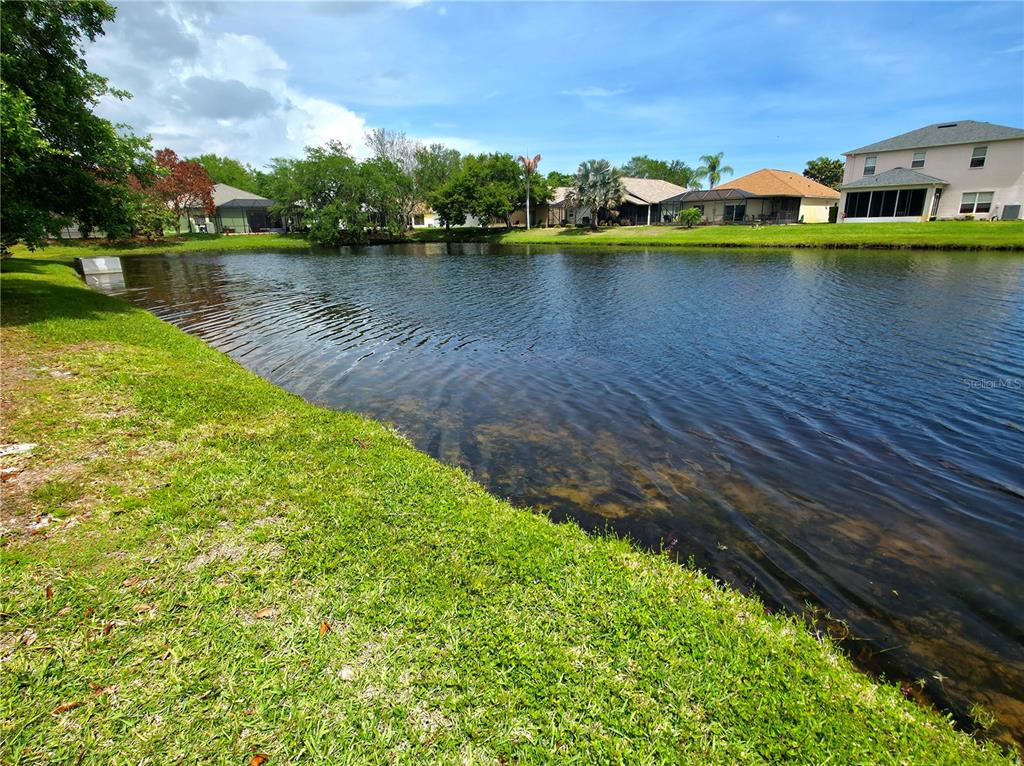 5465 High Pasture Way Melbourne, FL 32940 - Photo 28 of 39 a view of a lake with houses
