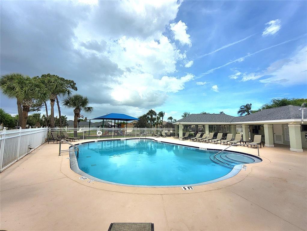 5465 High Pasture Way Melbourne, FL 32940 - Photo 31 of 39 a view of a swimming pool with outdoor seating