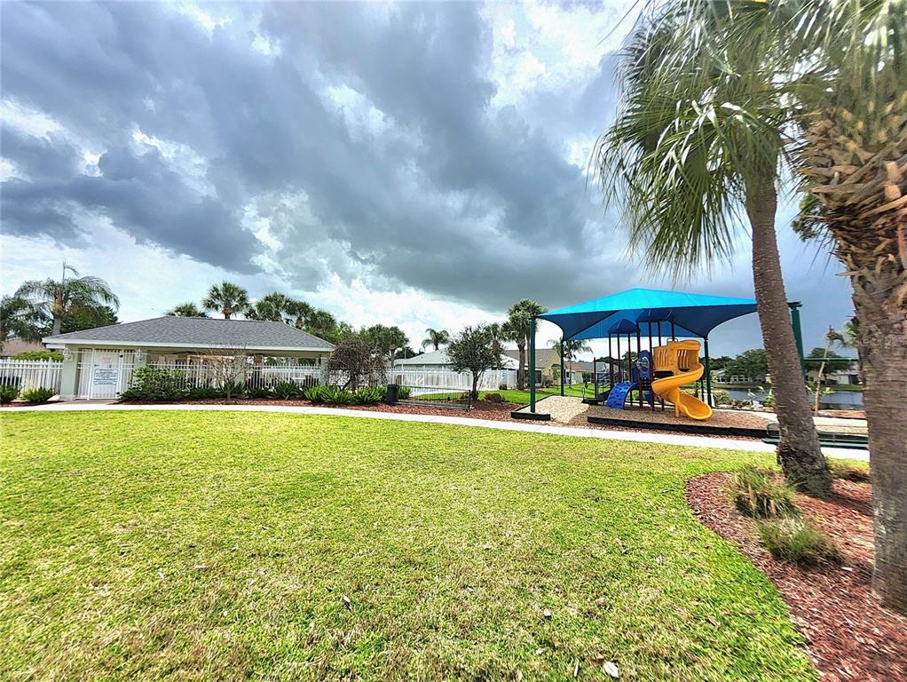 5465 High Pasture Way Melbourne, FL 32940 - Photo 33 of 39 a view of a house with a yard and sitting area