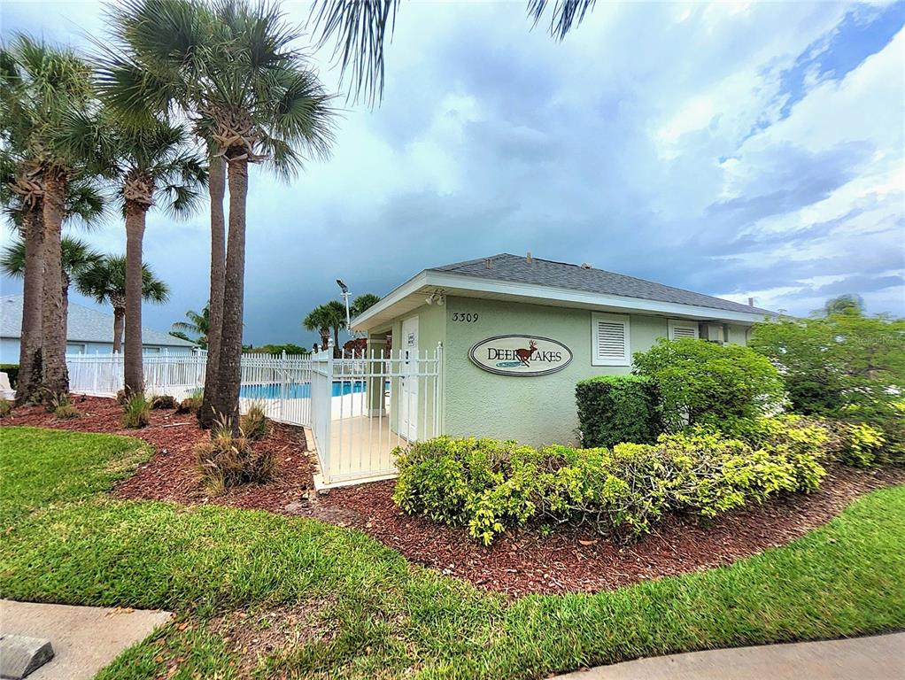 5465 High Pasture Way Melbourne, FL 32940 - Photo 36 of 39 a front view of a house with garden