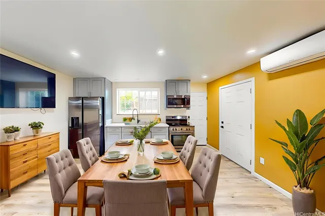 a dining room with furniture a window and kitchen view