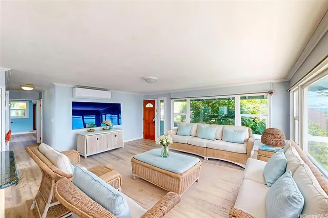 a living room with furniture and a large window