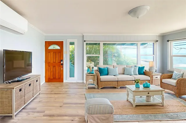 a living room with furniture and a flat screen tv