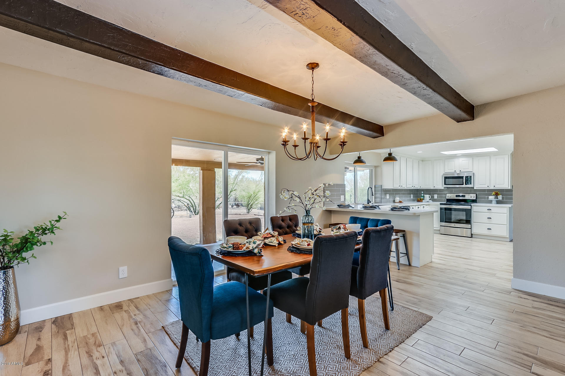 521 South Geronimo Road Apache Junction, AZ 85119 - Photo 14 of 40 a view of a dining room with furniture and wooden floor