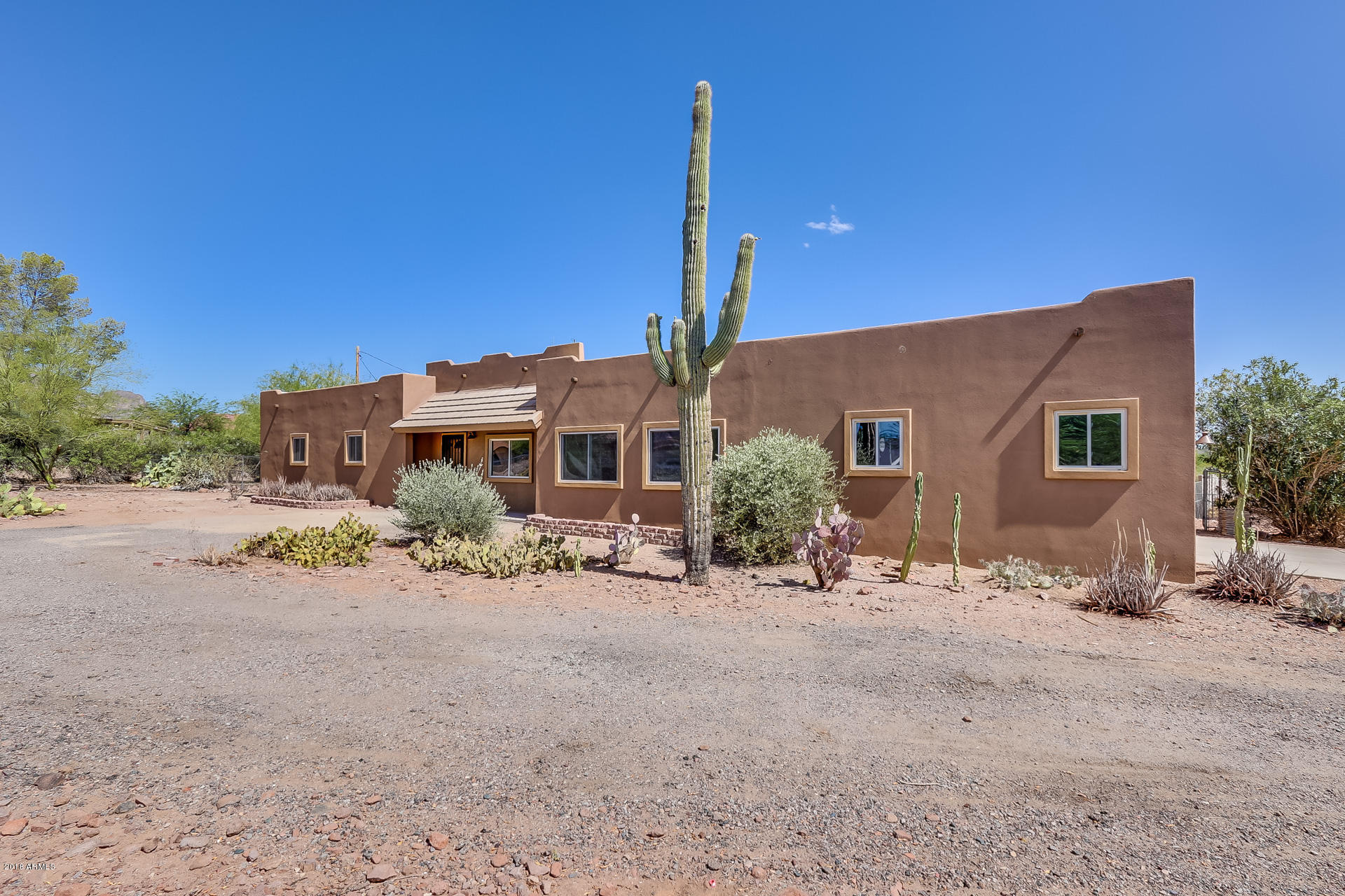 521 South Geronimo Road Apache Junction, AZ 85119 - Photo 3 of 40 a front view of a house with a outdoor space