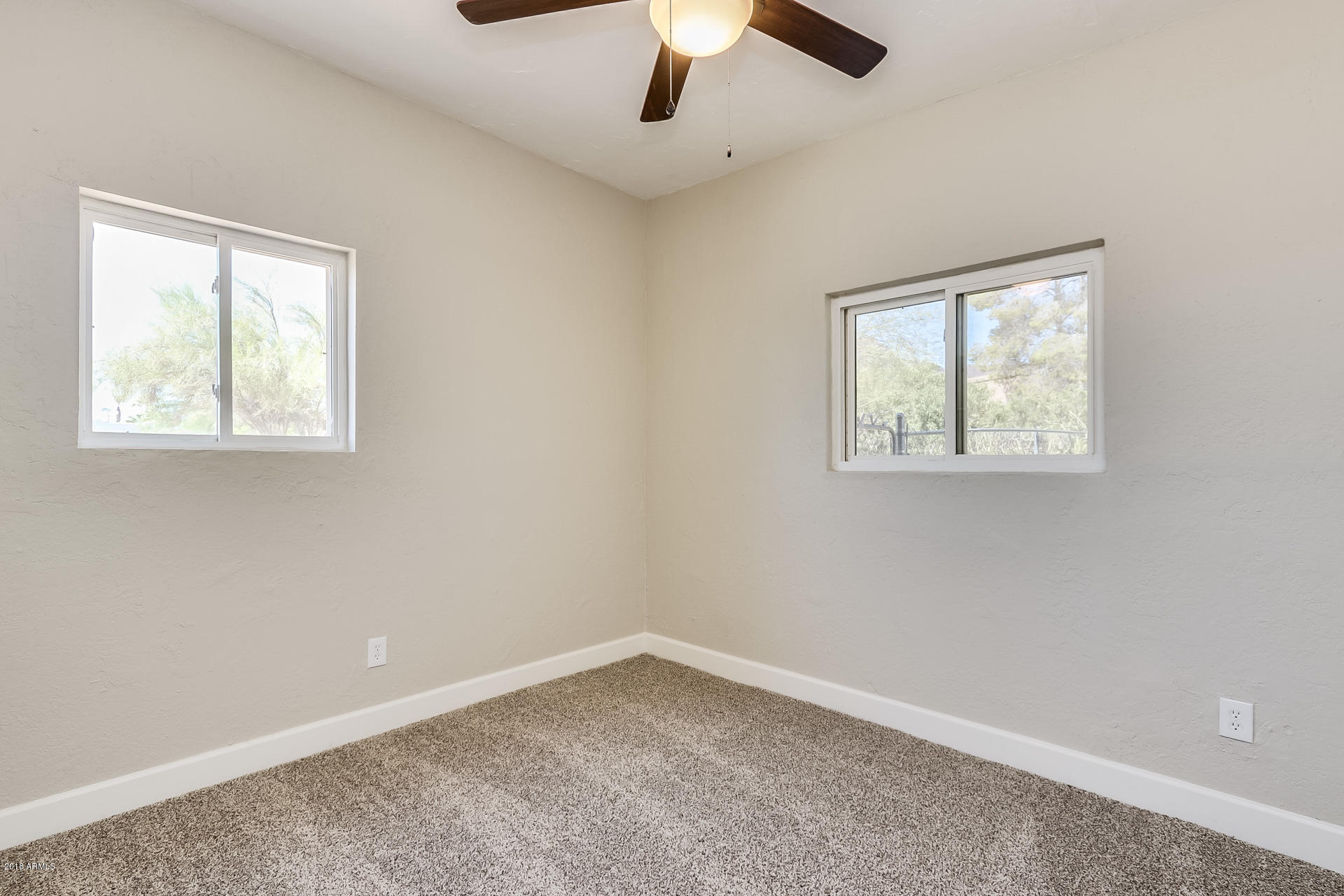 521 South Geronimo Road Apache Junction, AZ 85119 - Photo 34 of 40 an empty room with a window