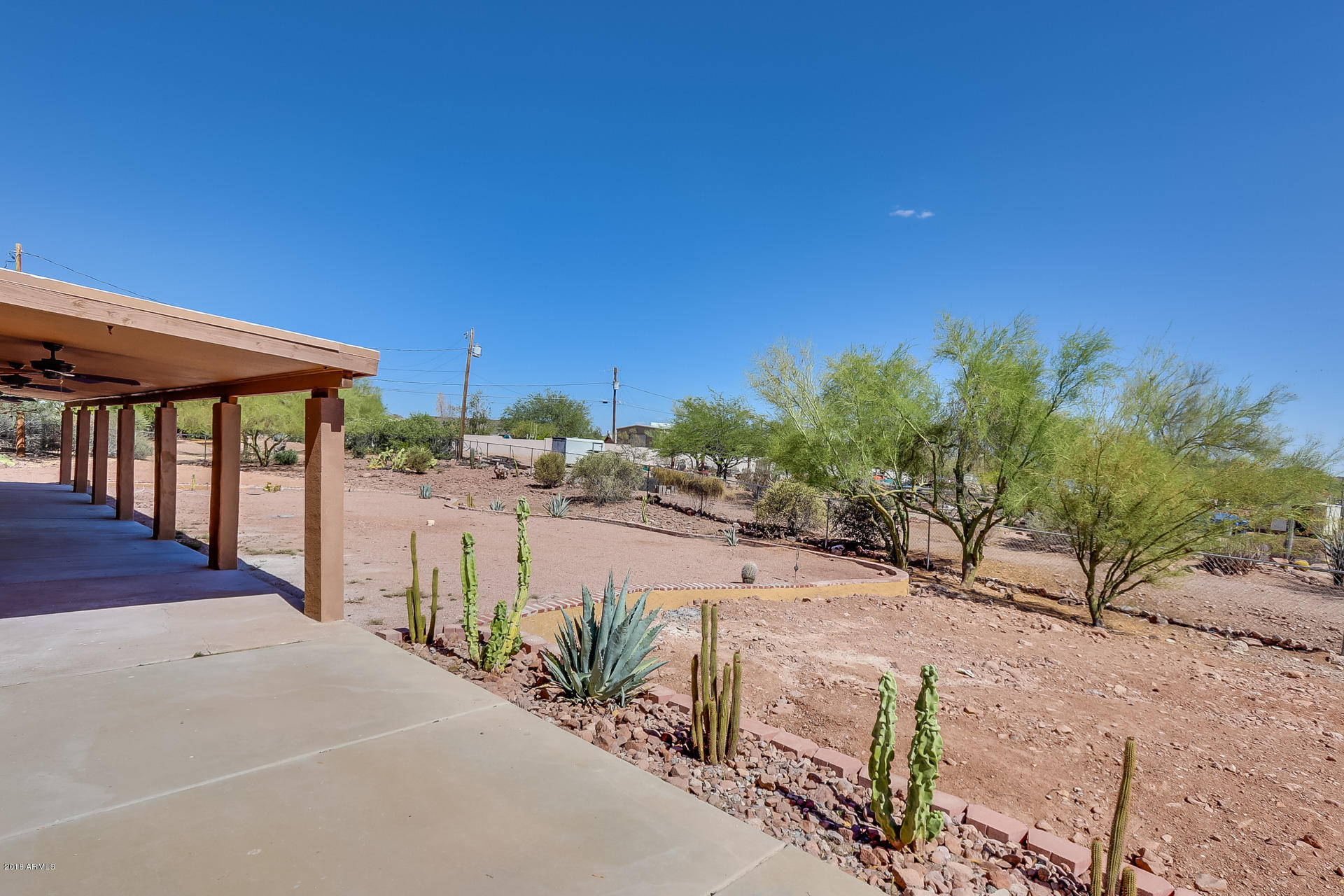 521 South Geronimo Road Apache Junction, AZ 85119 - Photo 5 of 40 a view of a terrace with a garden