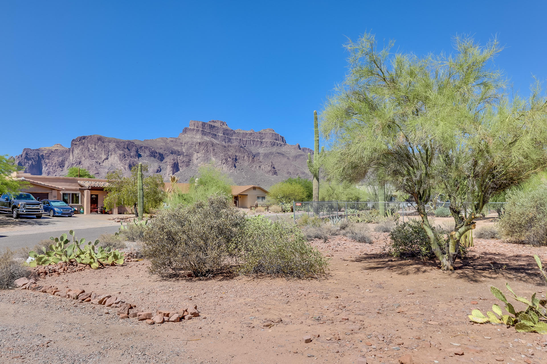 521 South Geronimo Road Apache Junction, AZ 85119 - Photo 9 of 40 a view of a road with a house in the background